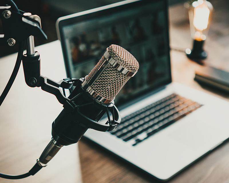 Microphone next to a laptop